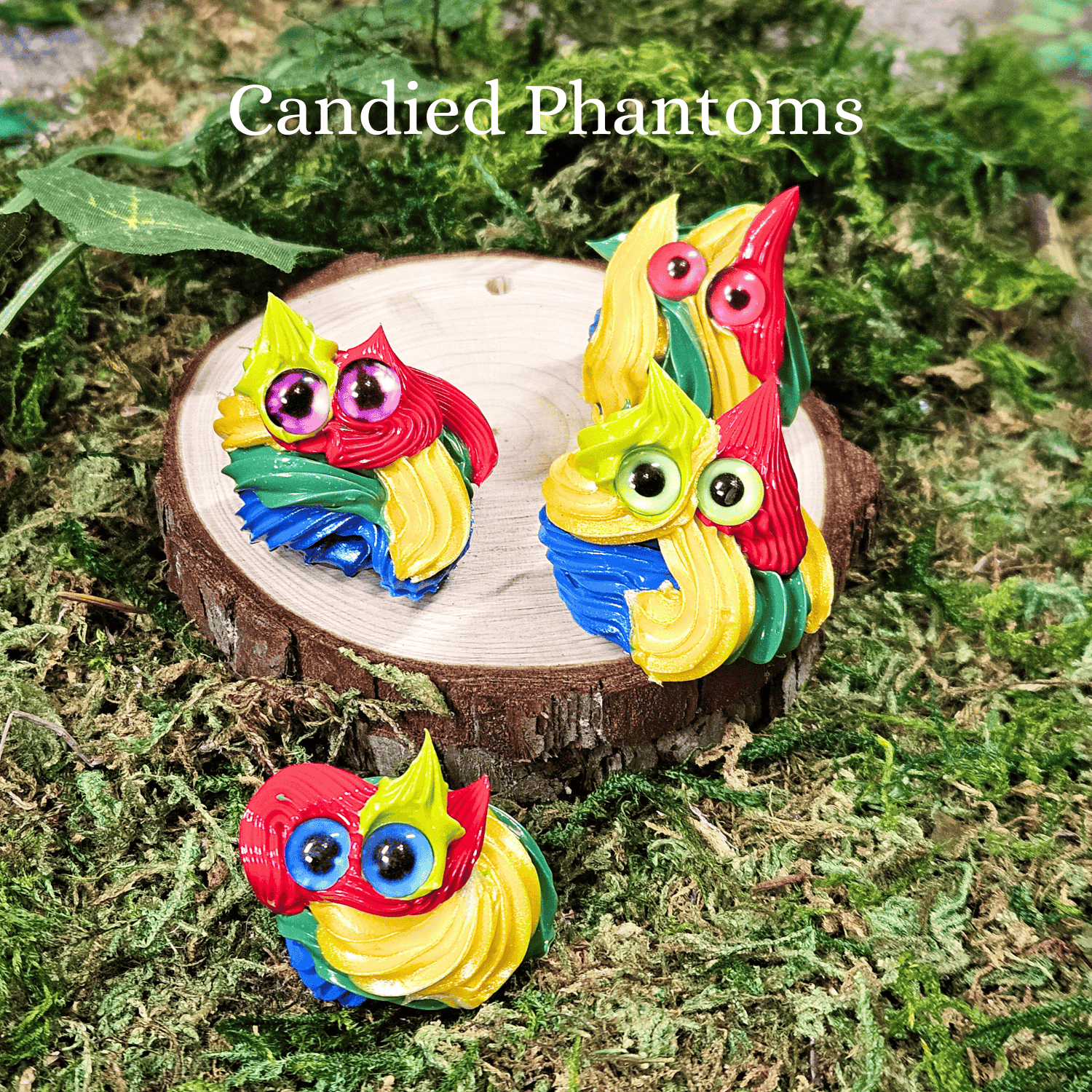 Colorful frosting creatures on a wooden stump with 'Candied Phantoms' text above.
