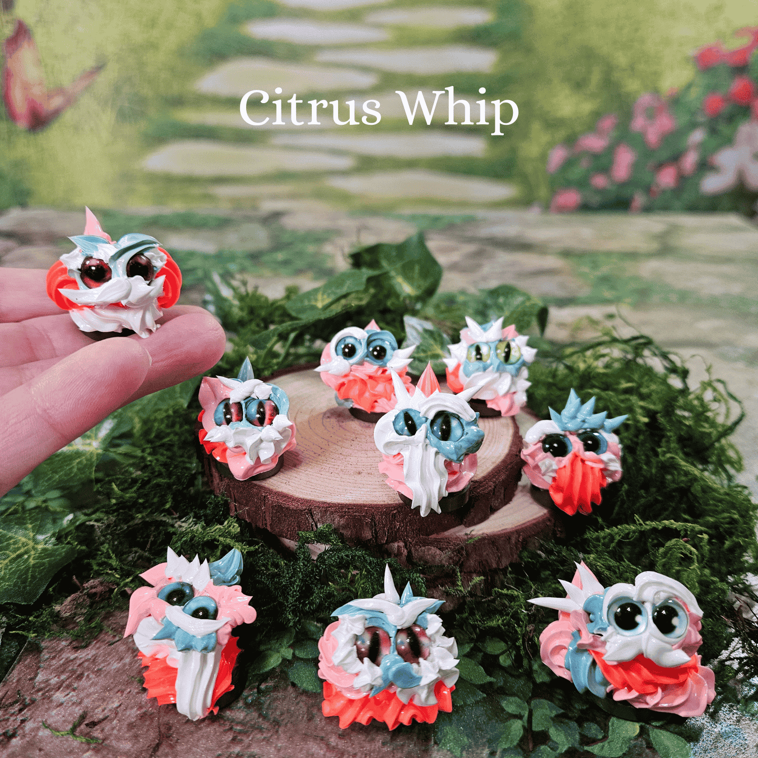 Small frosting creatures on a wooden platform with 'Citrus Whip' text above.