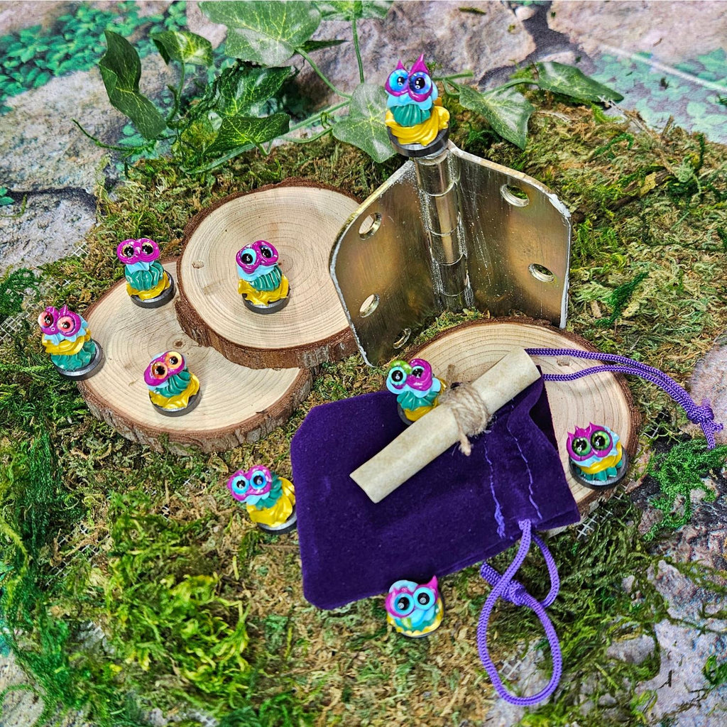 hinge topper creatures called hingekins posed with scroll and velvet bag