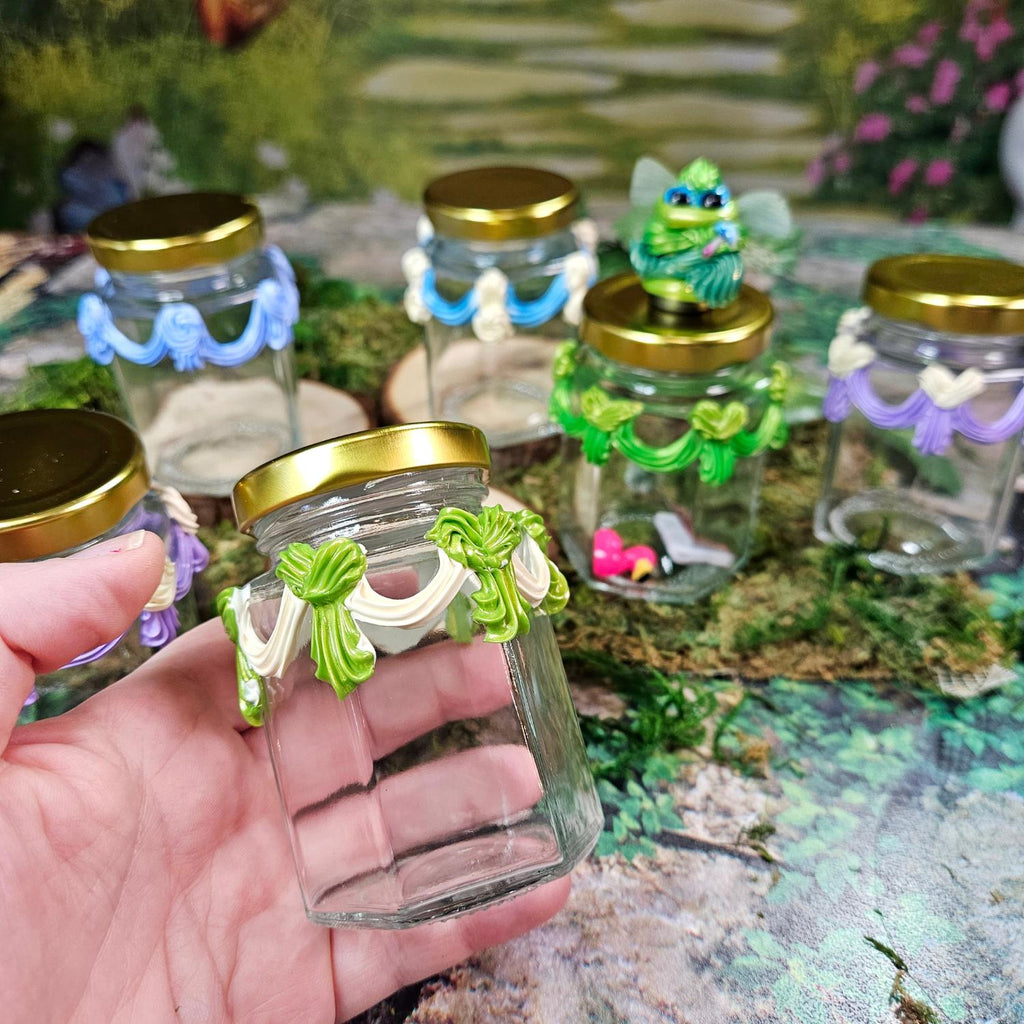 hand holding a frosted glass jar called a jarbliette
