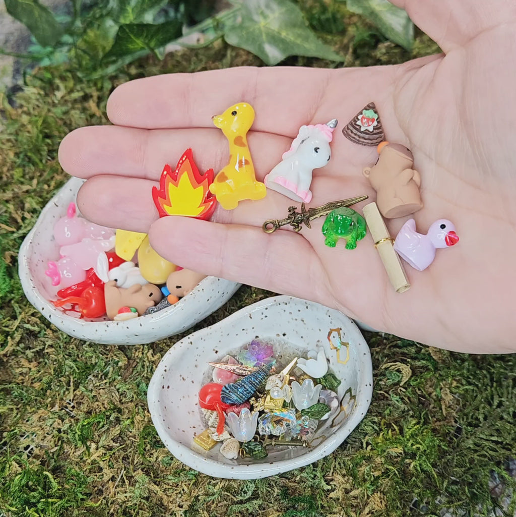 tiny miniature treasures of foods, animals, shells, etc being poured into bowls